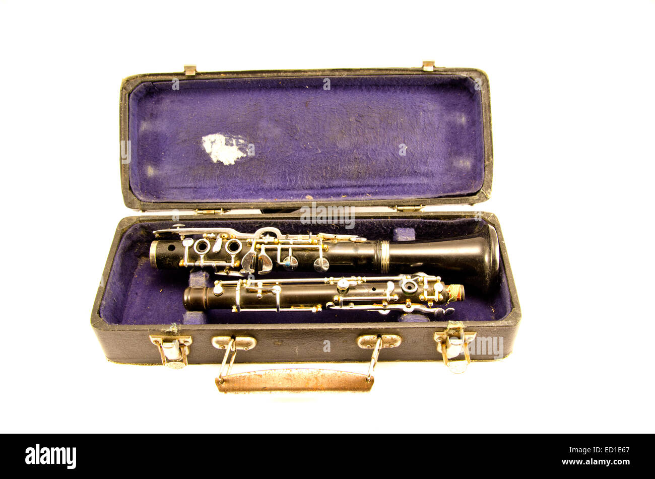 black antique clarinet musical instrument in old grunge case isolated on white Stock Photo