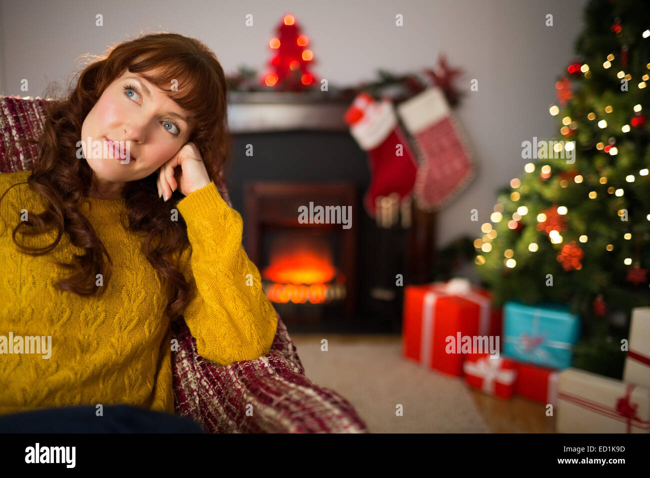 Beauty redhead thinking and relaxing at christmas Stock Photo