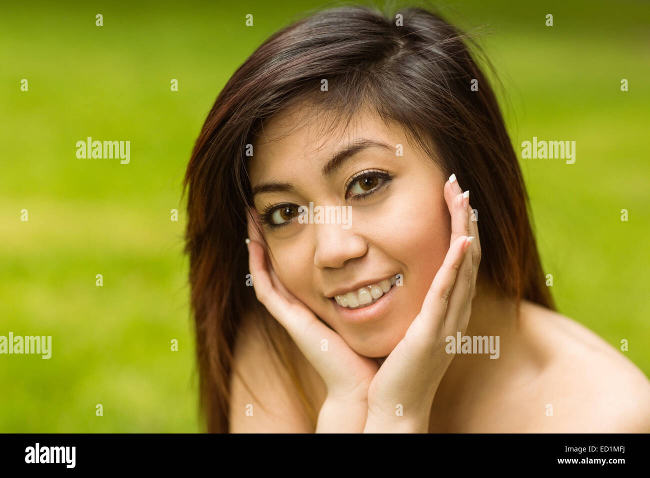 Portrait of beautiful woman in park Stock Photo - Alamy