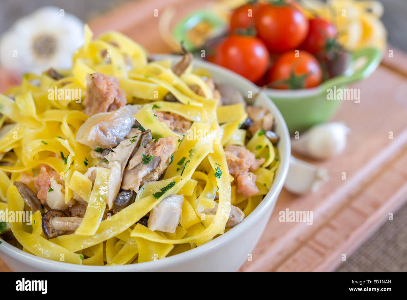 homemade tagliatelle mushrooms and sausage with spicy pepper Stock