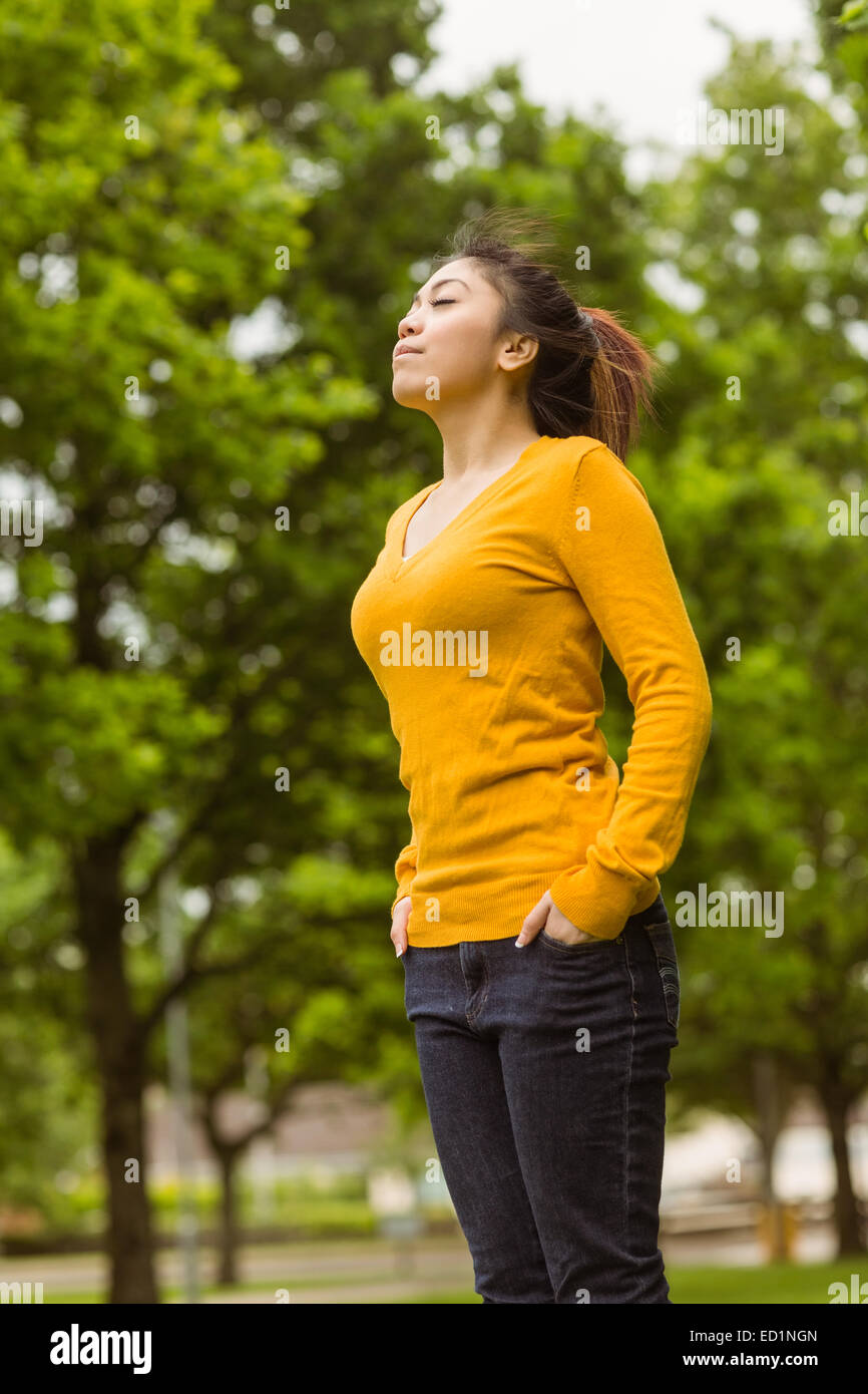 Beautiful woman with eyes closed in park Stock Photo - Alamy