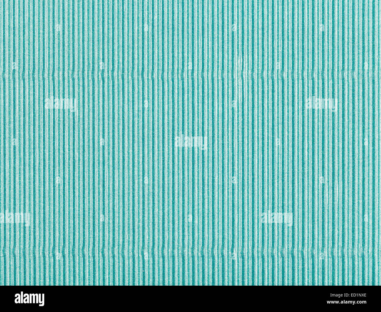 background from sheet of corrugated shiny green color paper close up Stock Photo