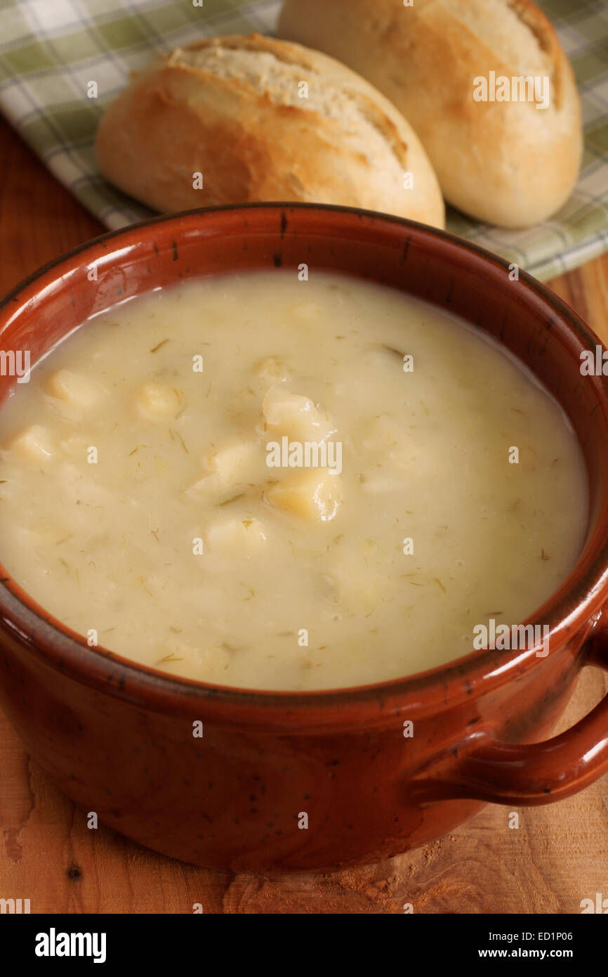 Leek and Potato Soup with bread rolls Stock Photo