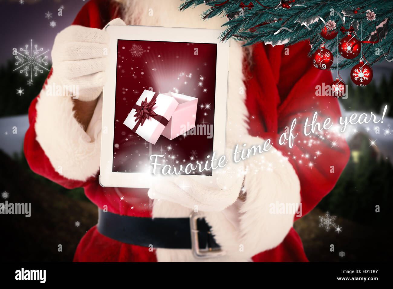 Composite image of santa claus showing tablet pc Stock Photo - Alamy