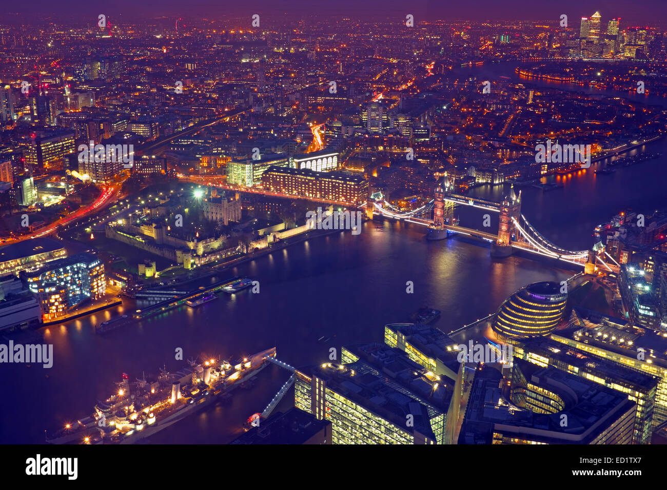 London rooftop view panorama at sunset with urban architectures and The Tower Bridge with Thames River at night Stock Photo