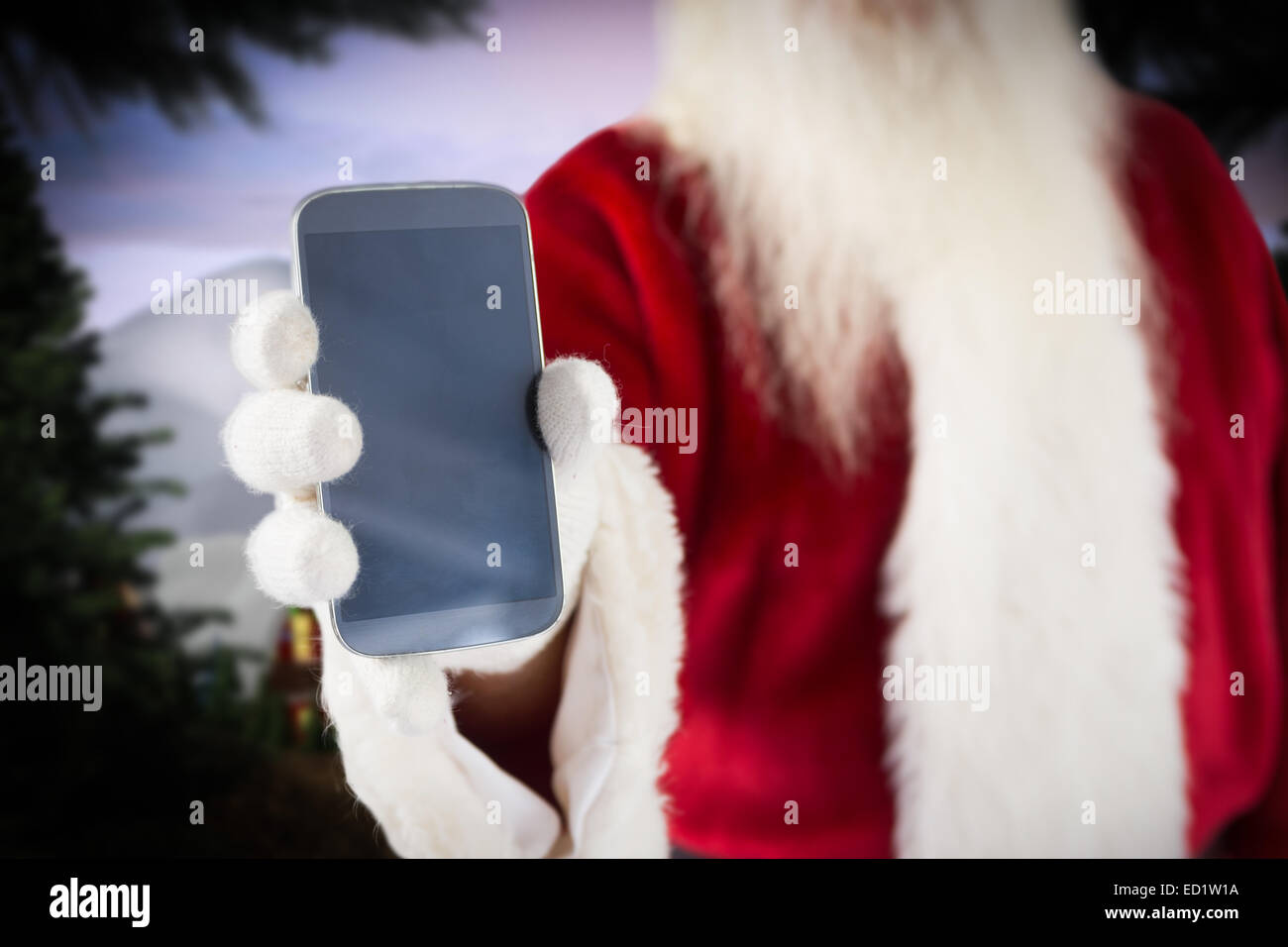 Composite image of santa claus showing smartphone Stock Photo - Alamy