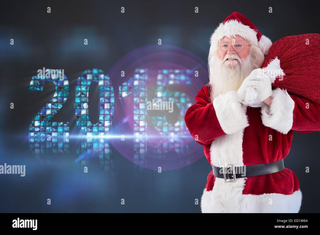 Composite image of santa carries his red bag and smiles Stock Photo - Alamy
