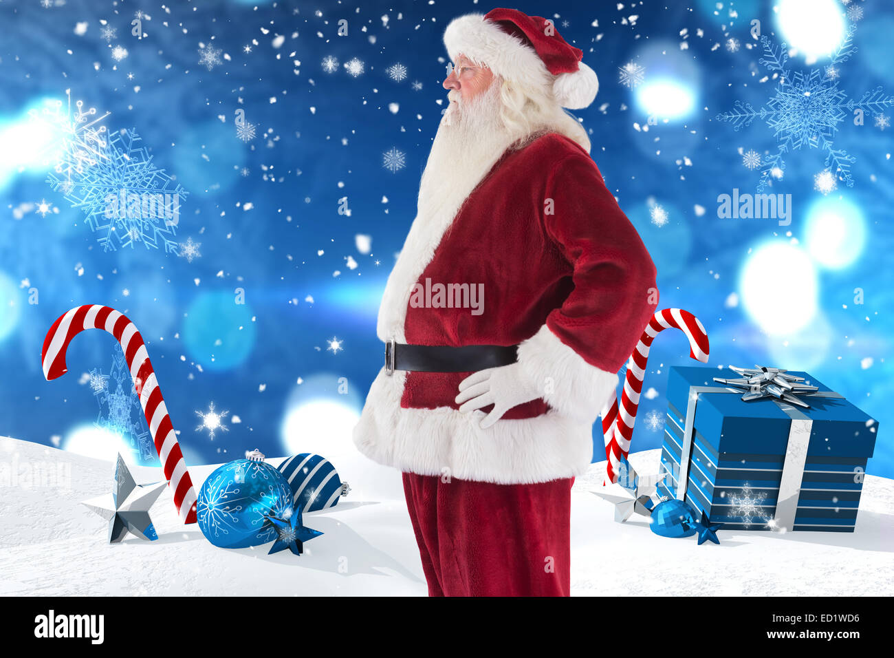 Composite image of santa claus shows his side to camera Stock Photo - Alamy