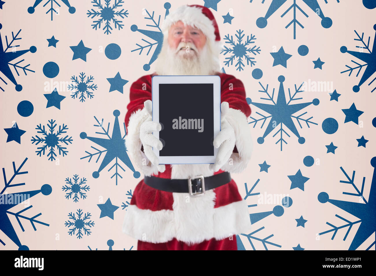 Composite image of santa presents a tablet pc Stock Photo - Alamy