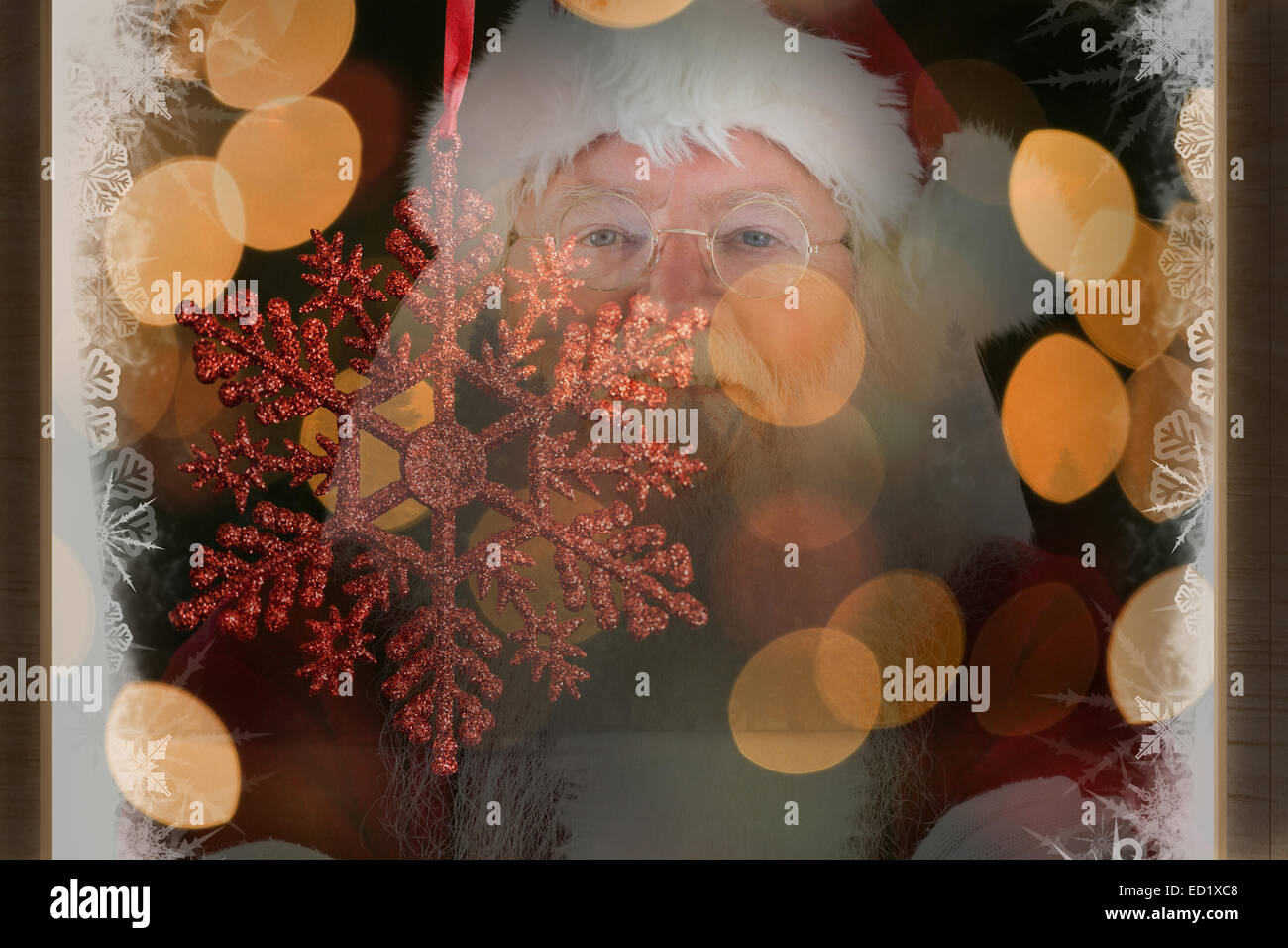 Composite image of santa smiles with folded arms Stock Photo - Alamy