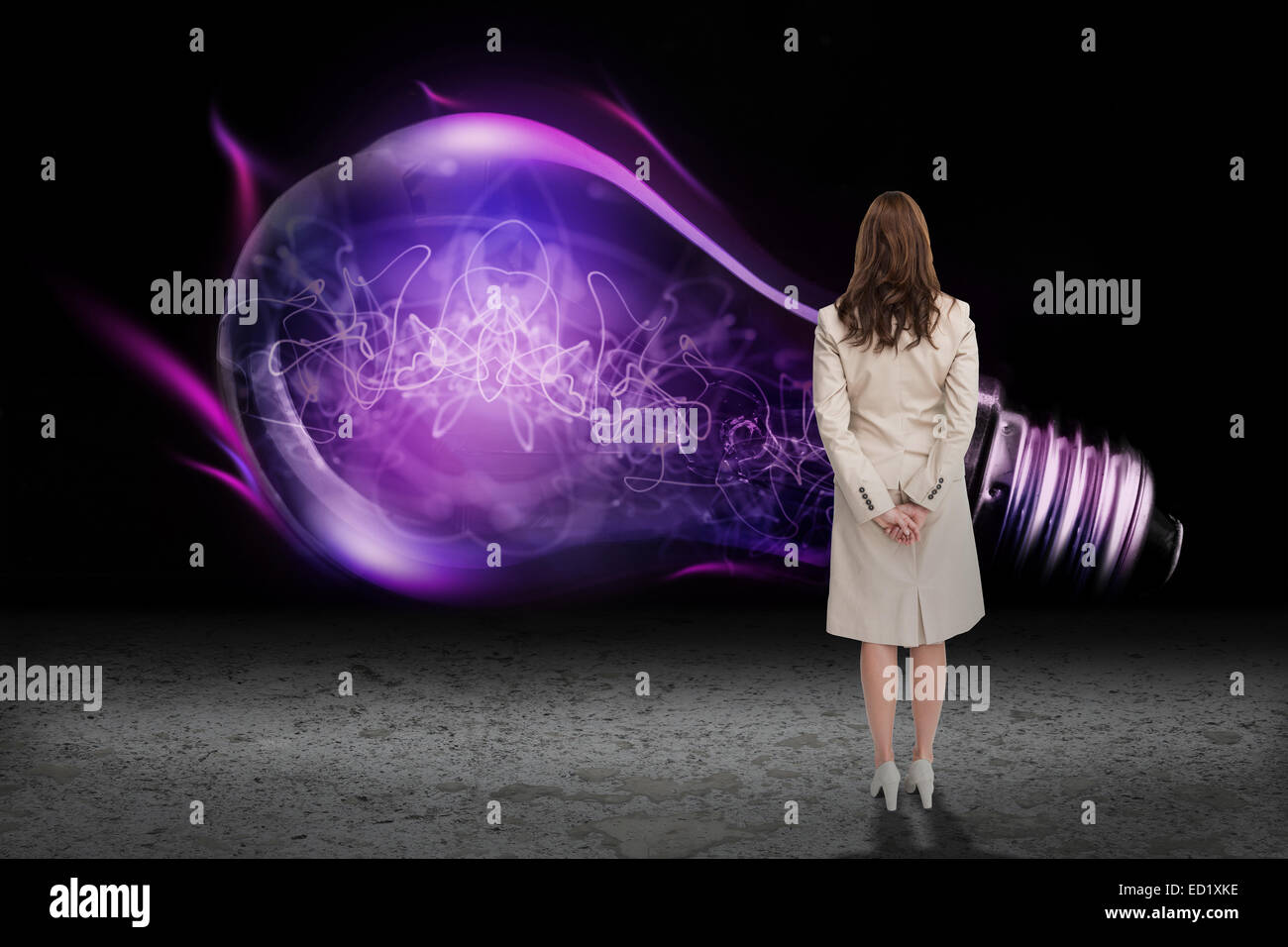 Composite image of rear view of businesswoman Stock Photo - Alamy