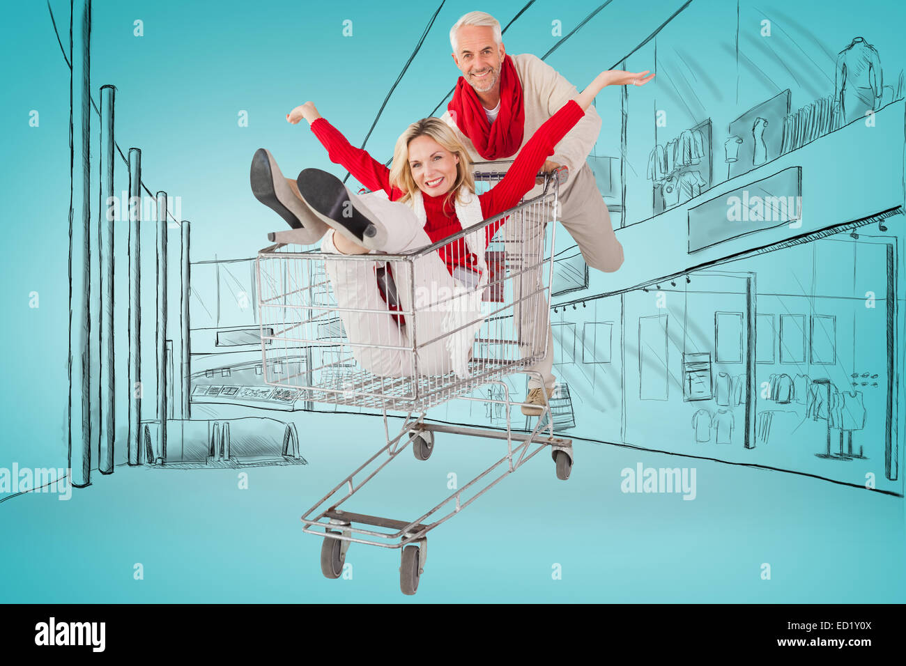 Composite image of happy festive couple messing in trolley Stock Photo ...