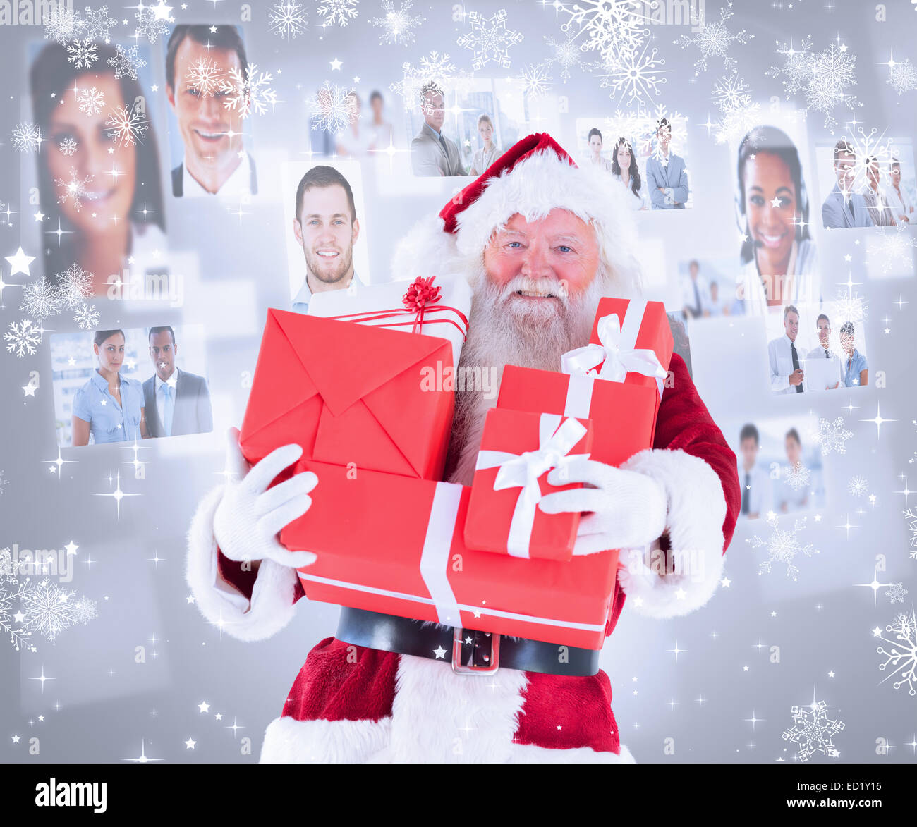 Composite image of santa carries a few presents Stock Photo - Alamy