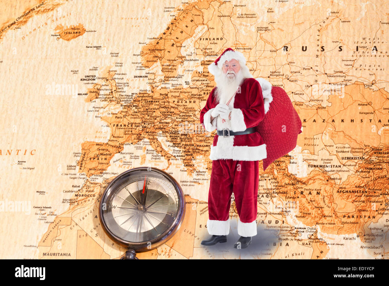 Composite image of santa carries his red bag Stock Photo - Alamy