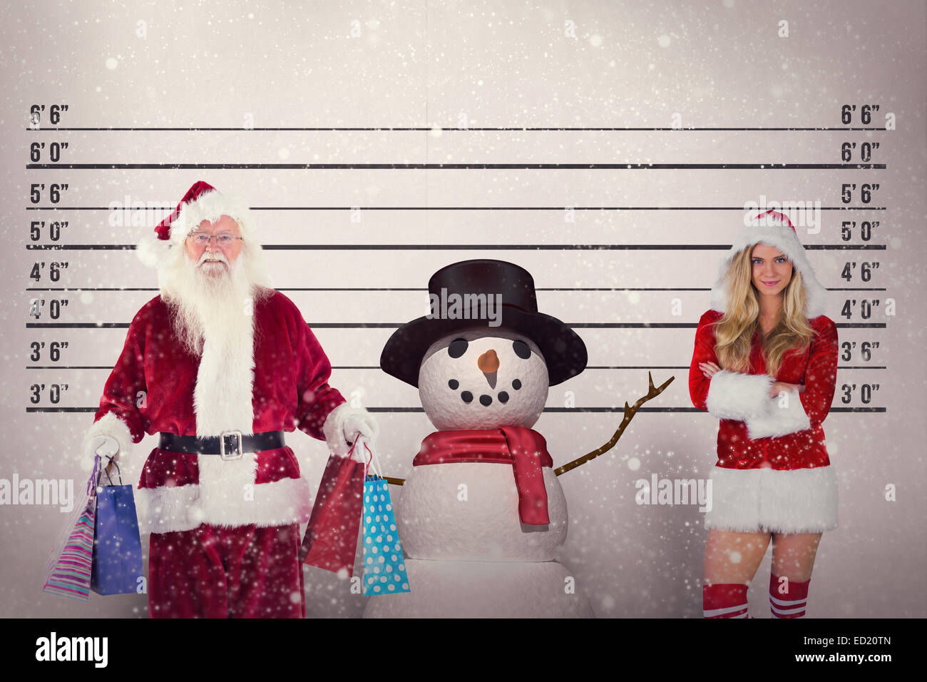 Composite image of santa carries some christmas bags Stock Photo - Alamy