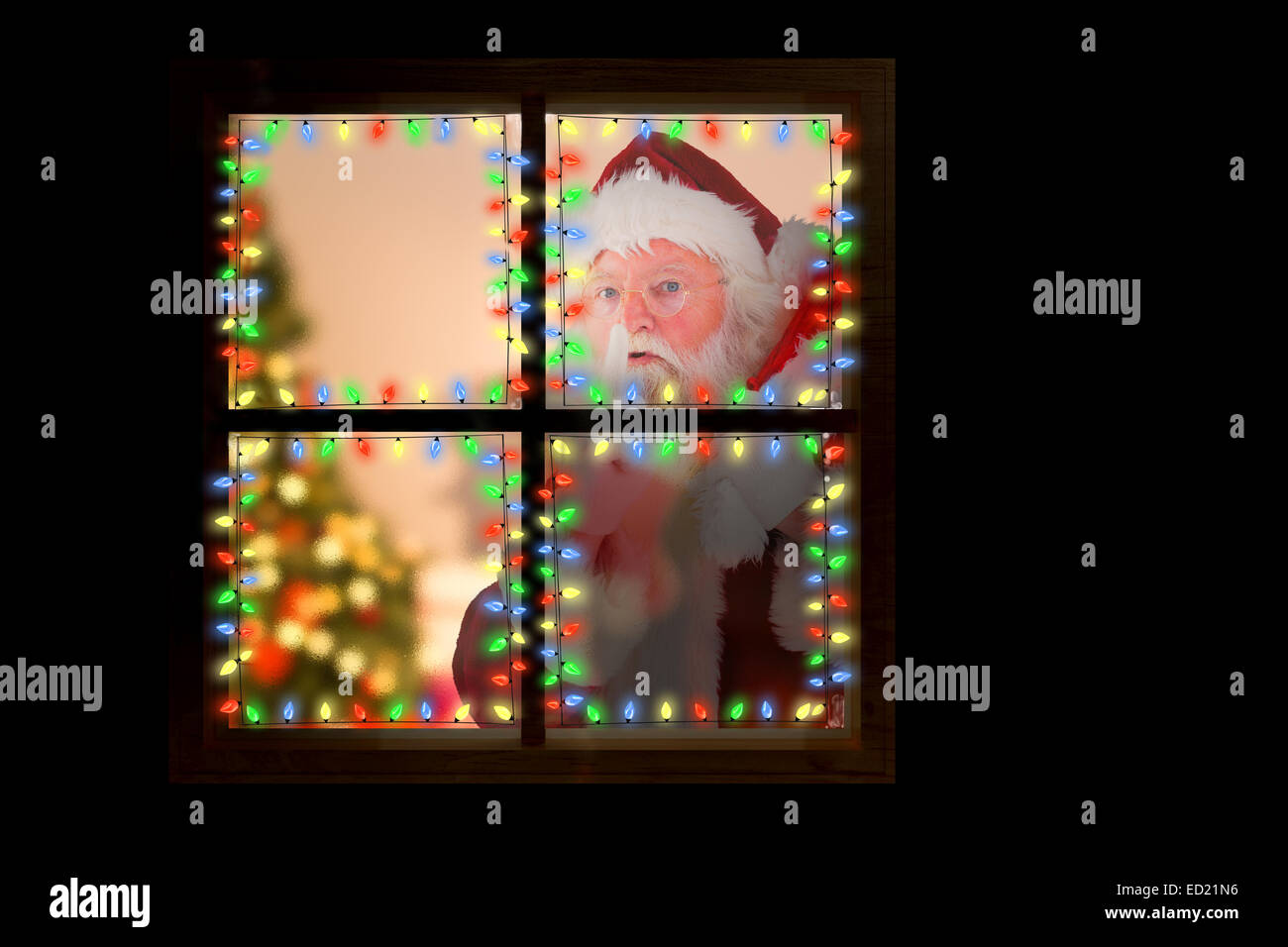 Composite image of santa claus carrying sack Stock Photo - Alamy