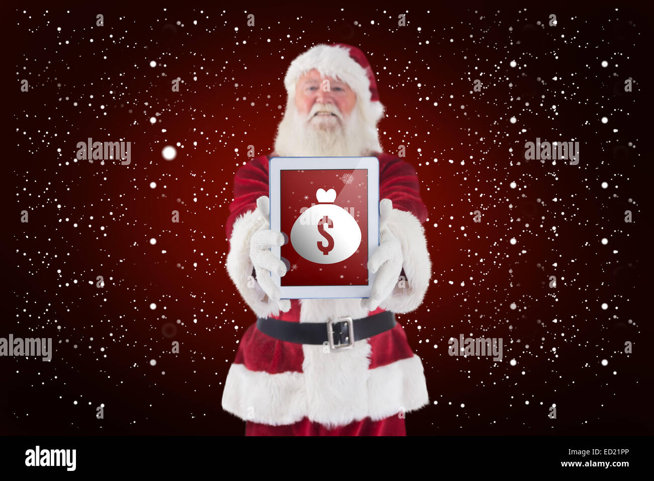 Composite image of santa presents a tablet pc Stock Photo - Alamy