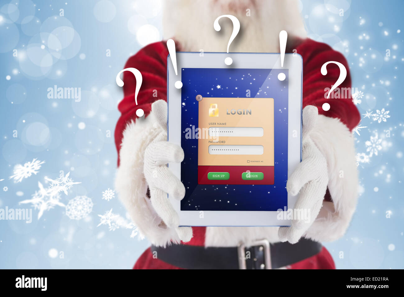 Composite image of santa presents a tablet pc Stock Photo - Alamy