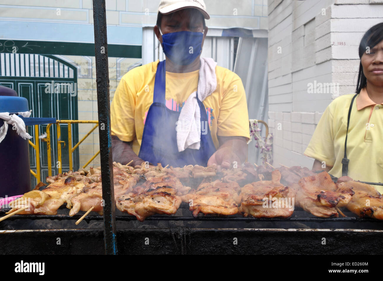 Thai chicken barbecue offered by vendor. Thai street market, Bangkok, South-east Asia Thailand. Stock Photo