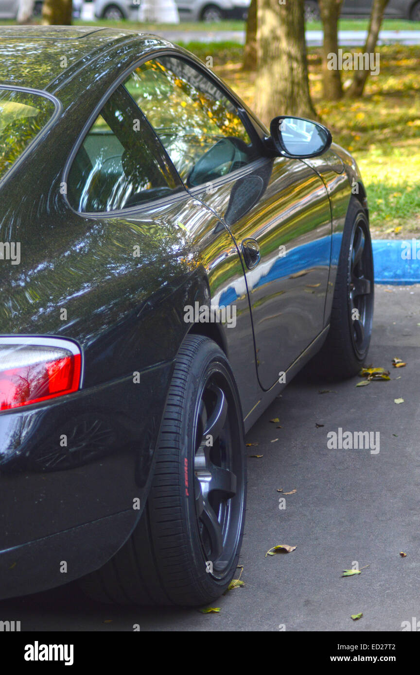 Expensive Car Rear Brand expensive car. Rear wheel. Headlamp. Mirror Front View Autumn ...