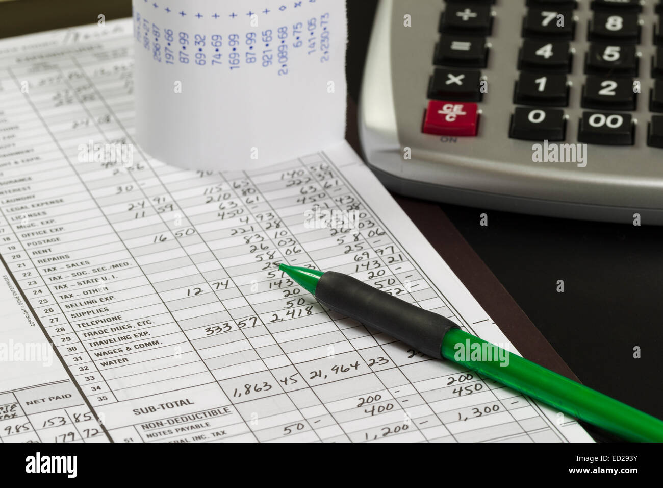 accounting set up with pencil, ledger, calculator and tape. Stock Photo