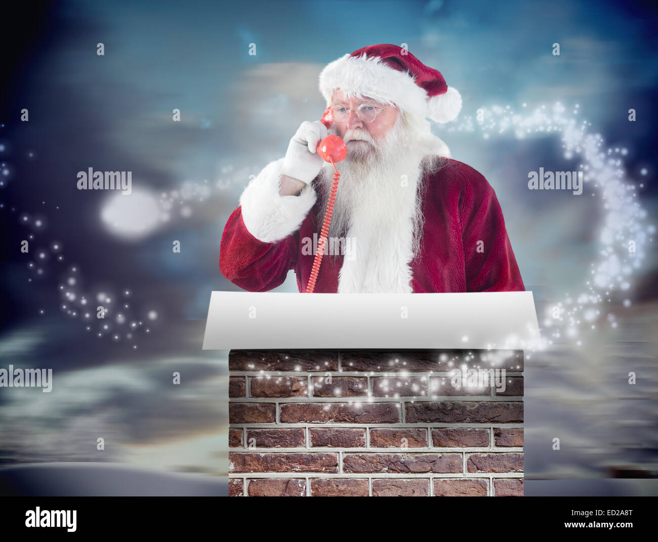 Composite image of santa on his red phone Stock Photo - Alamy