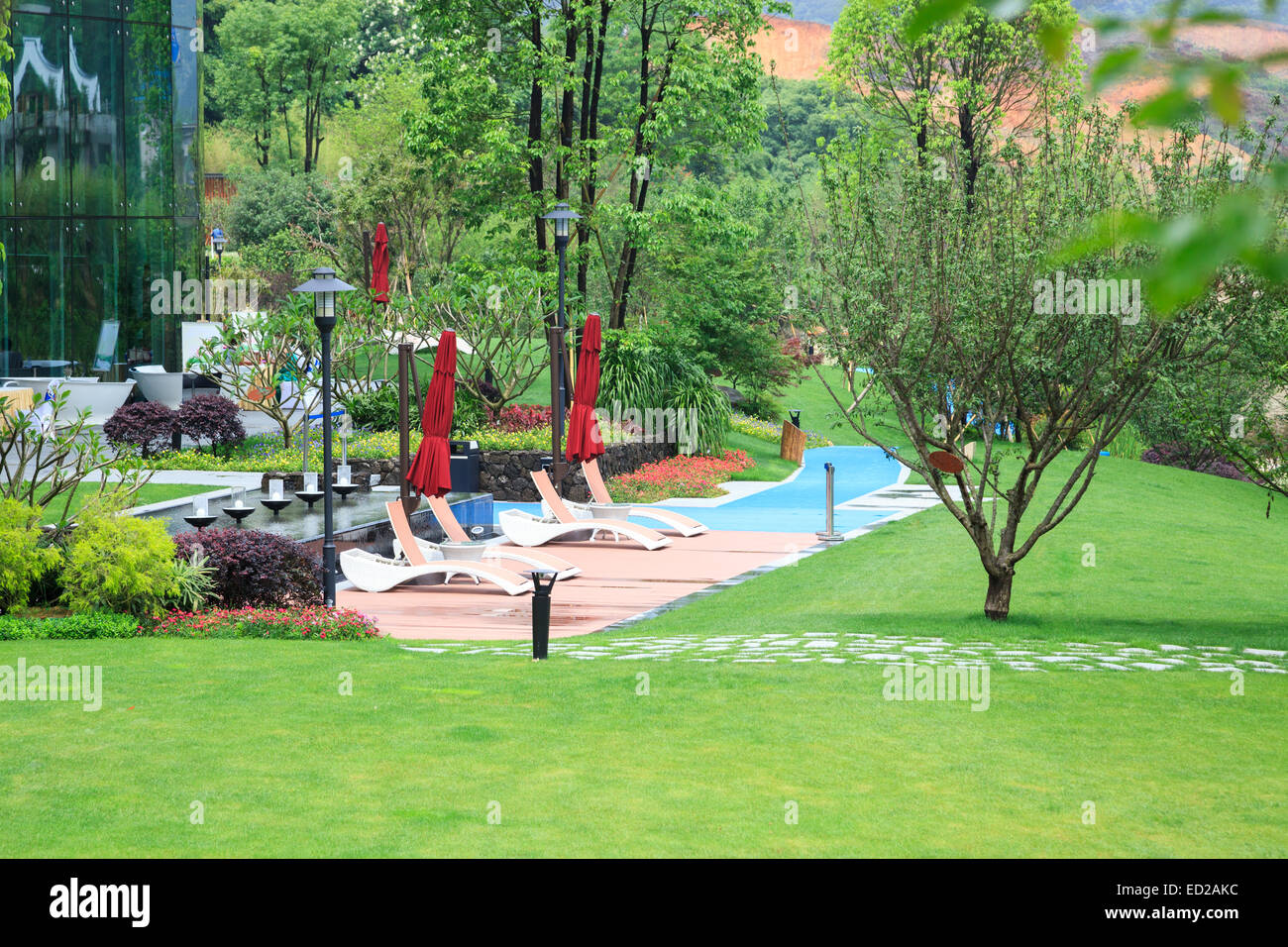 Beautiful summer park with green lawns and flower beds Stock Photo - Alamy