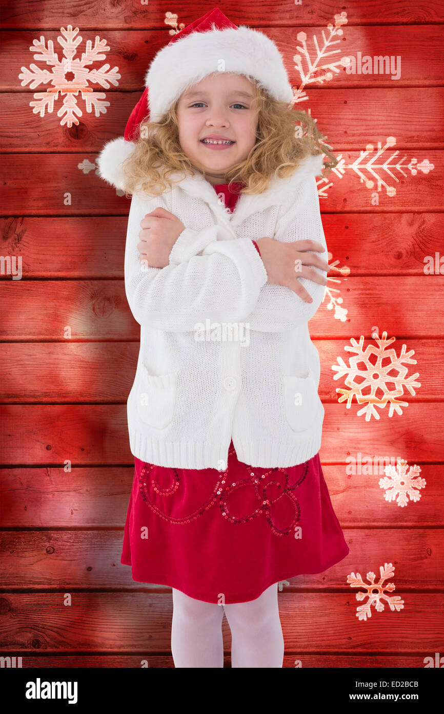 Composite image of festive little girl smiling at camera Stock Photo ...