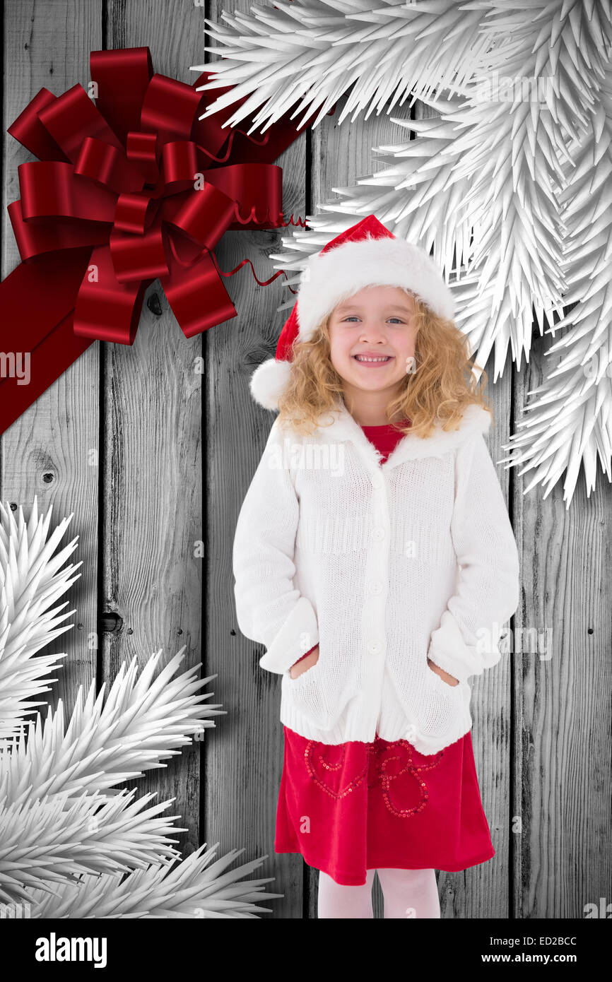 Composite image of festive little girl smiling at camera Stock Photo ...