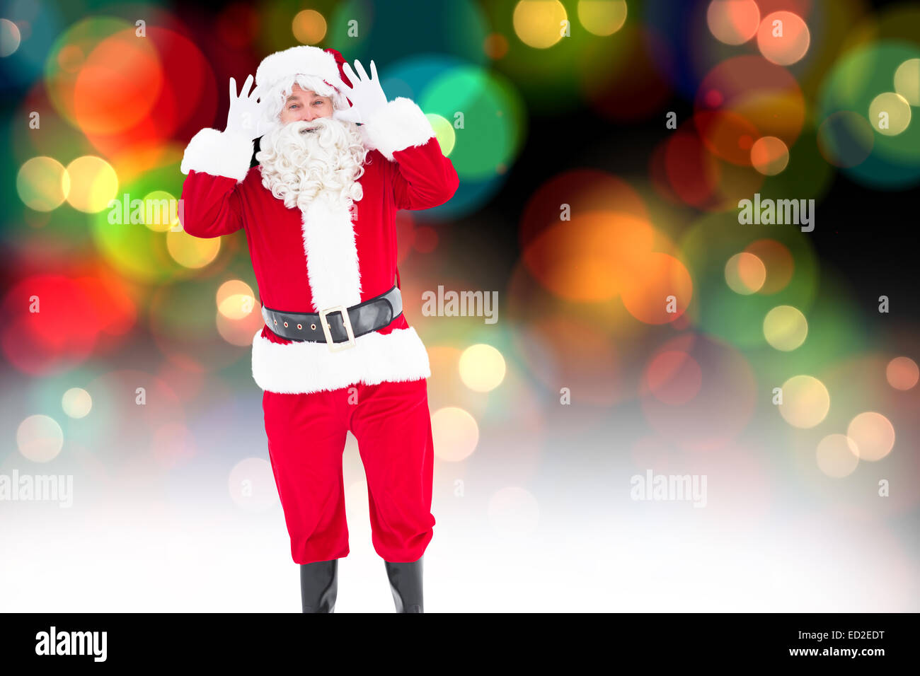 Composite image of portrait of happy santa claus posing Stock Photo - Alamy