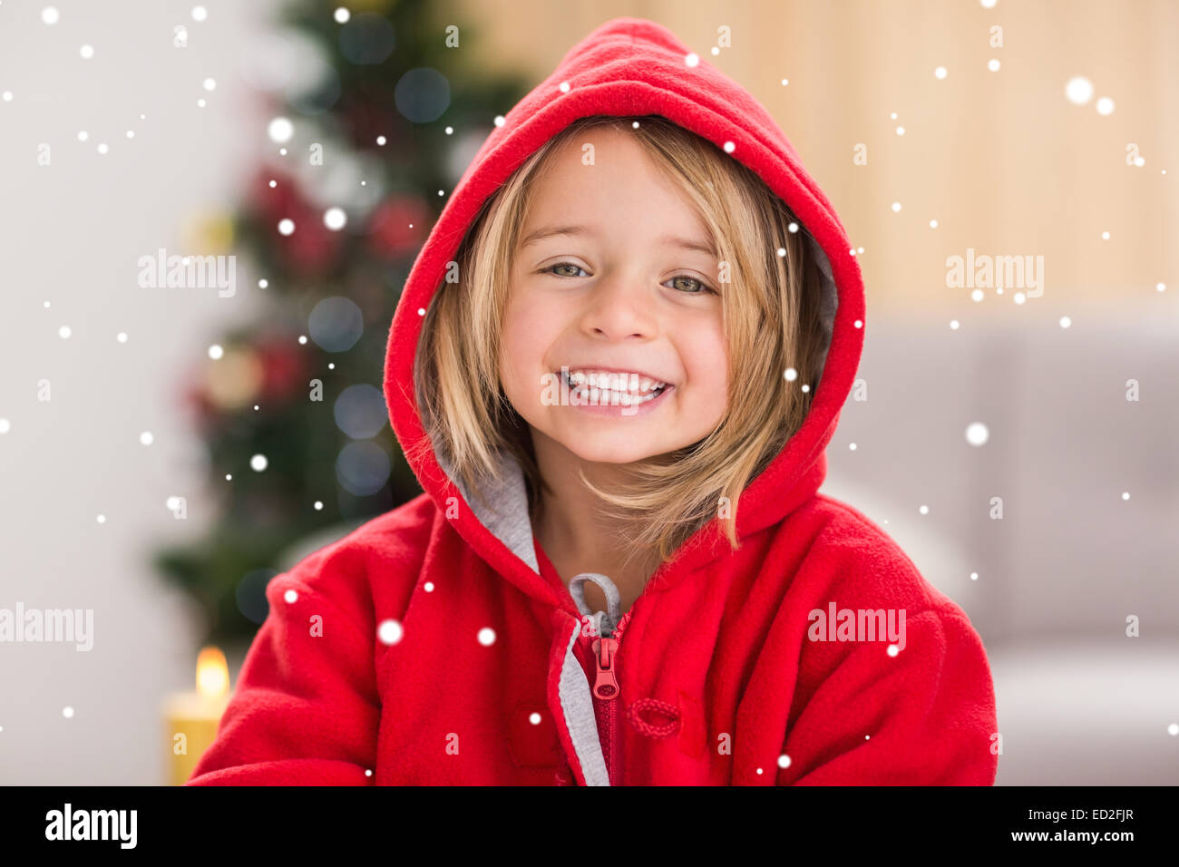 Composite image of festive little girl smiling at camera Stock Photo ...