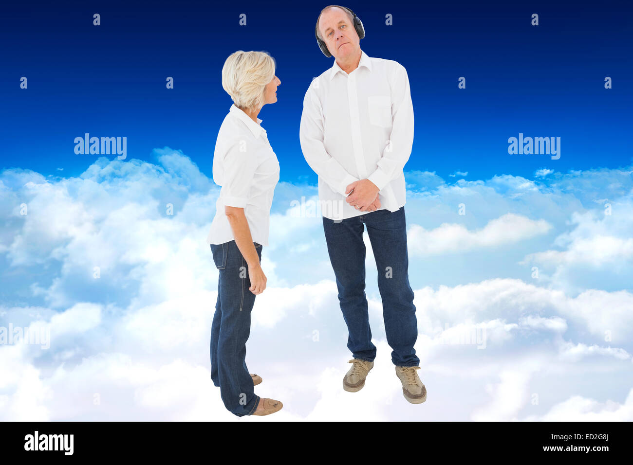 Composite image of annoyed woman being ignored by her partner Stock Photo