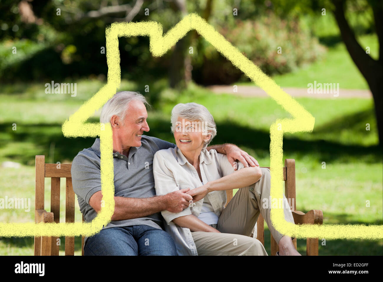 Composite image of senior couple sitting on a bench Stock Photo