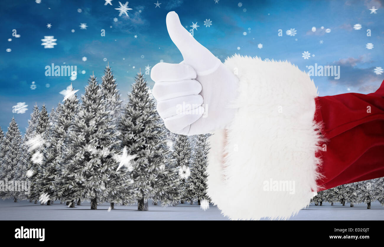Composite image of positive santa claus with thumbs up Stock Photo - Alamy