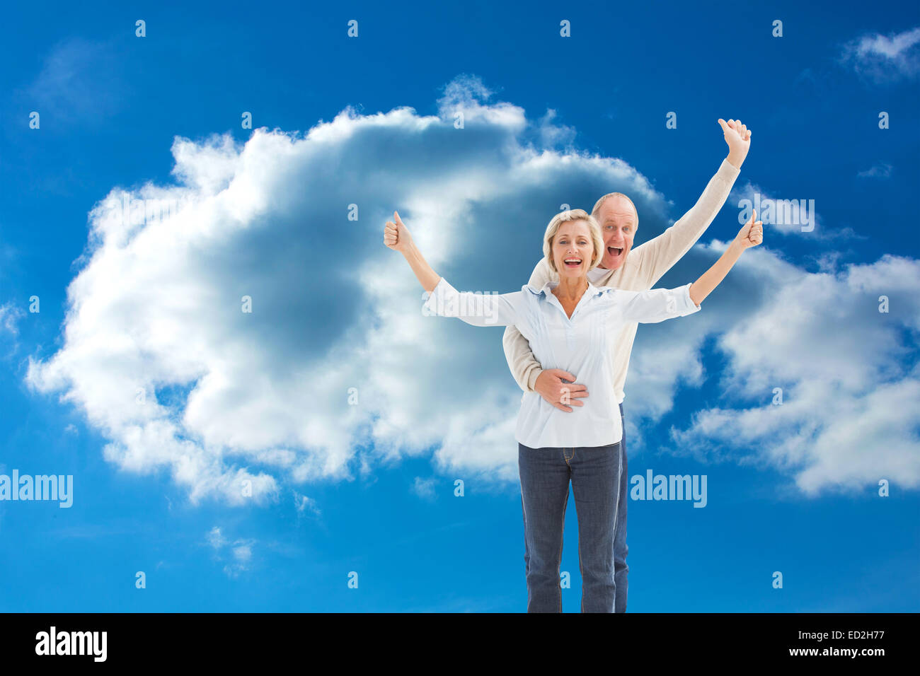 Composite image of happy mature couple cheering at camera Stock Photo ...
