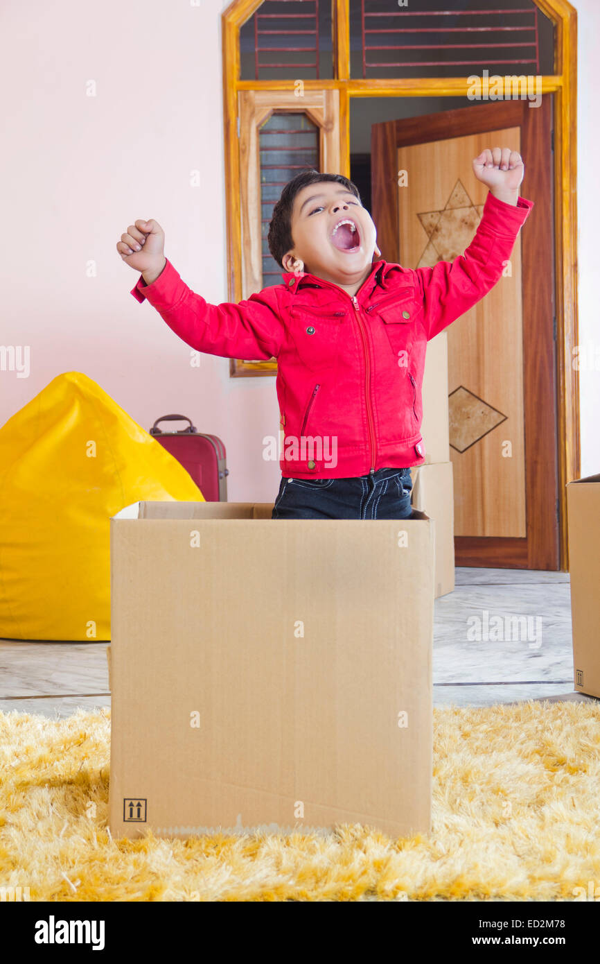 1 indian child boy home fun Carton box Stock Photo