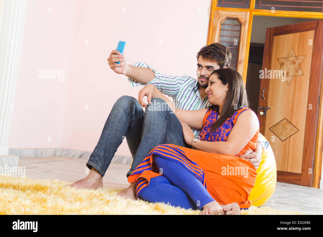 2 indian married couple sitting home Selfie phone Stock Photo