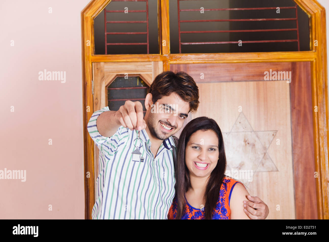 2 indian married couple new house key Stock Photo