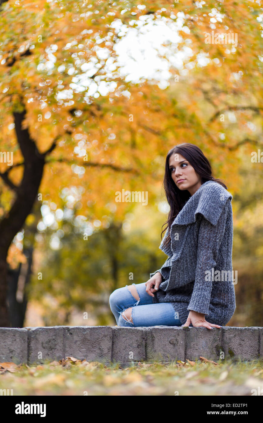 Young woman in the autumn park Stock Photo - Alamy