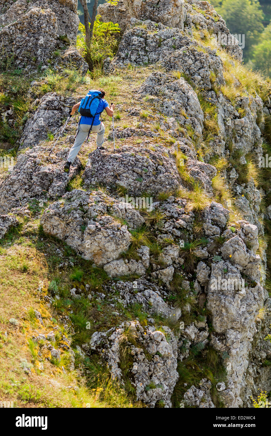 Young man hiking on the mountain Stock Photo