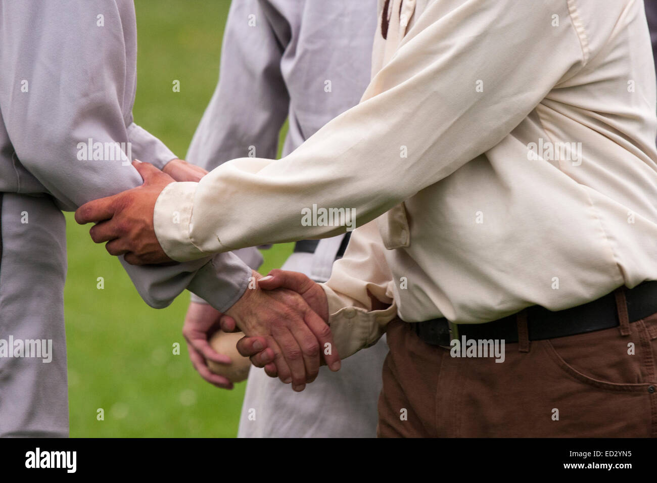 Vintage Base Ball Milwaukee Cream Citys team shaking hands with the Milwaukee Grays after a 1860s base ball game in Wisconsin Stock Photo