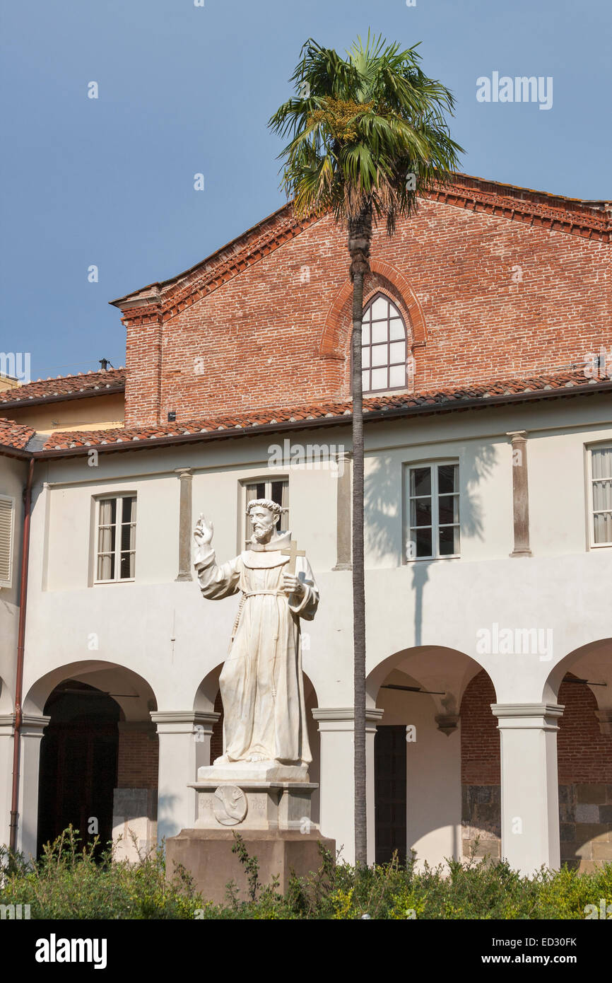 statue of unknown monk in the courtyard of church San Francesco. Lucca, Tuscany, Italy. Stock Photo