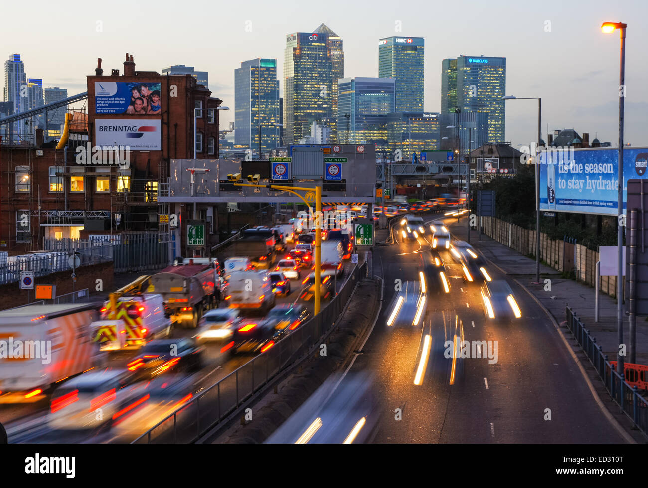 Traffic on A102 Blackwall Tunnel Approach with Canary Wharf skyscrapers