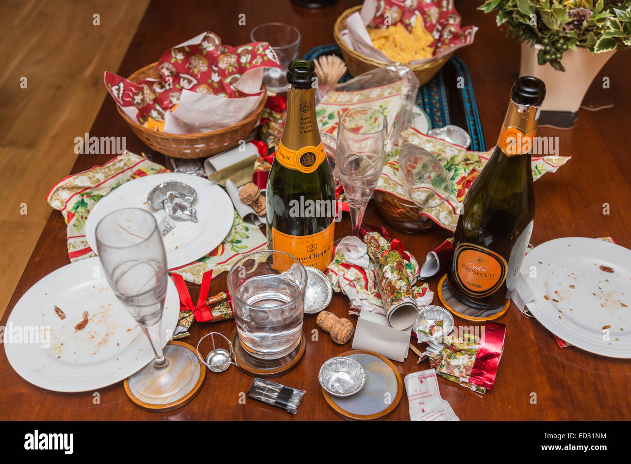 Debris in the aftermath of a festive season party with an empty Veuve