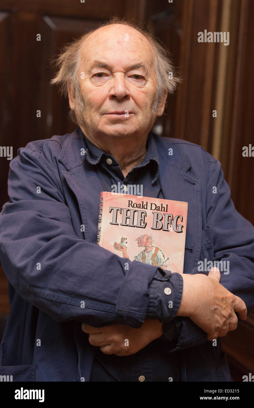 London, UK. 4 December 2014. Illustrator Sir Quentin Blake holds a copy of The BFG. On Monday, 8 December 2014, Sotheby's will host 'First Editions: Redrawn', an auction of annotated first editions from some of the world's greatest living illustrators to raise money for the 'House of Illustration'.  Thirty-four much loved illustrators - and some authors - have annotated and re-drawn timeless classics, giving a unique insight into the creative process involved. Each illustrator has carefully selected and returned their chosen books, providing additional illustrations Stock Photo