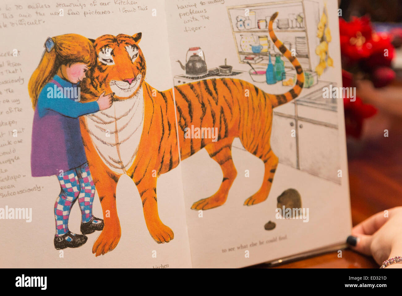 London, UK. 4 December 2014. Judith Kerr's 'The Tiger who came to tea' features annotations on the story behind the creation as well as the tiger wearing a top hat. On Monday, 8 December 2014, Sotheby's will host 'First Editions: Redrawn', an auction of annotated first editions from some of the world's greatest living illustrators to raise money for the 'House of Illustration'.  Thirty-four much loved illustrators - and some authors - have annotated and re-drawn timeless classics, giving a unique insight into the creative process involved. Stock Photo