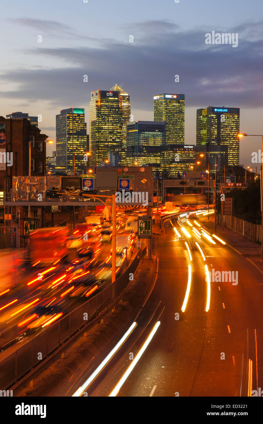 Traffic on A102 Blackwall Tunnel Approach with Canary Wharf skyscrapers in the background, London England United Kingdom UK Stock Photo