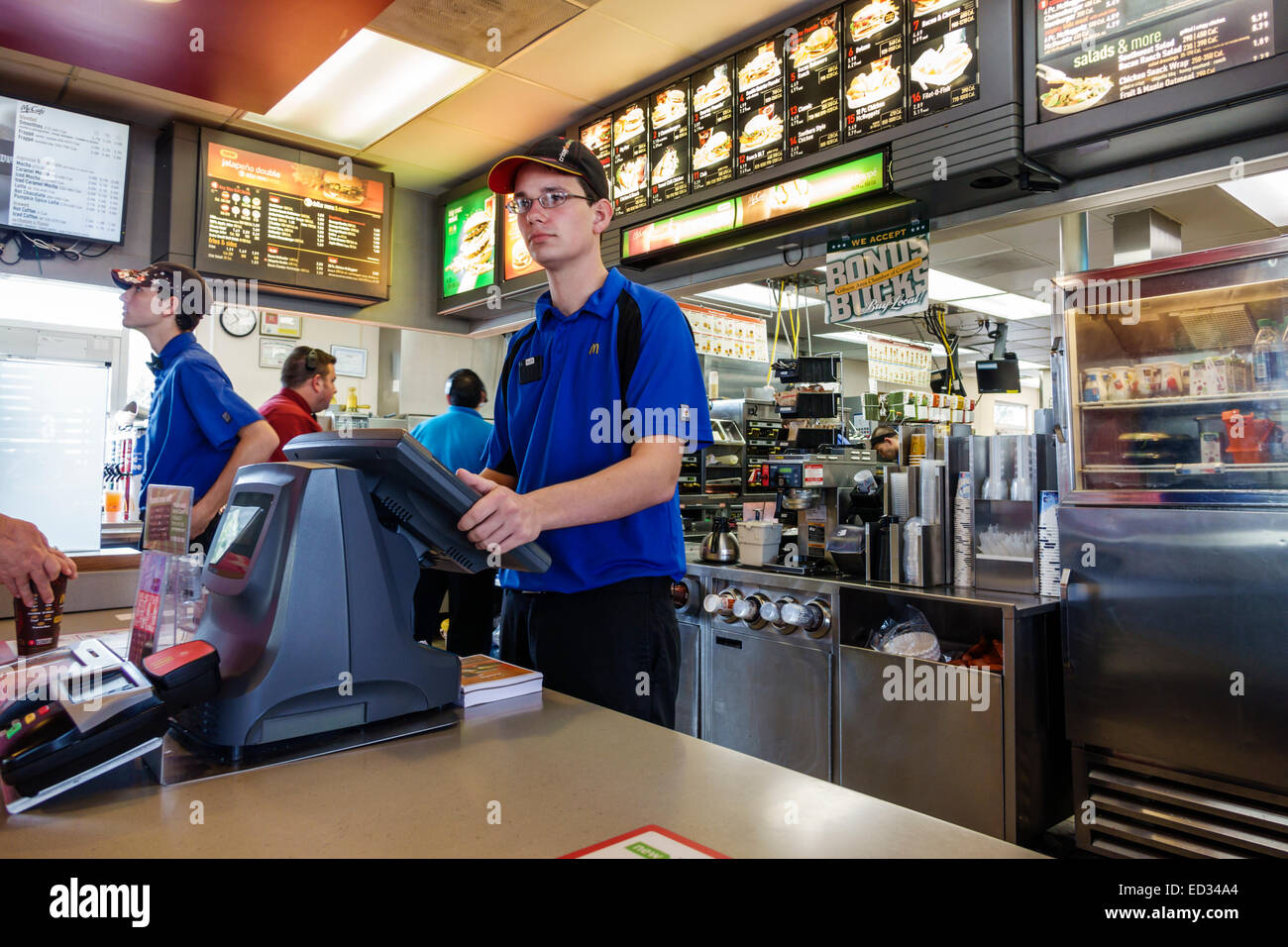 Illinois Gibson City,McDonald's,fast food,restaurant restaurants dining cafe cafes,counter,man men male,employee worker workers working staff,working, Stock Photo