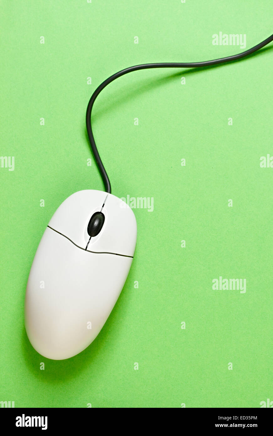 Computer mouse on green background Stock Photo