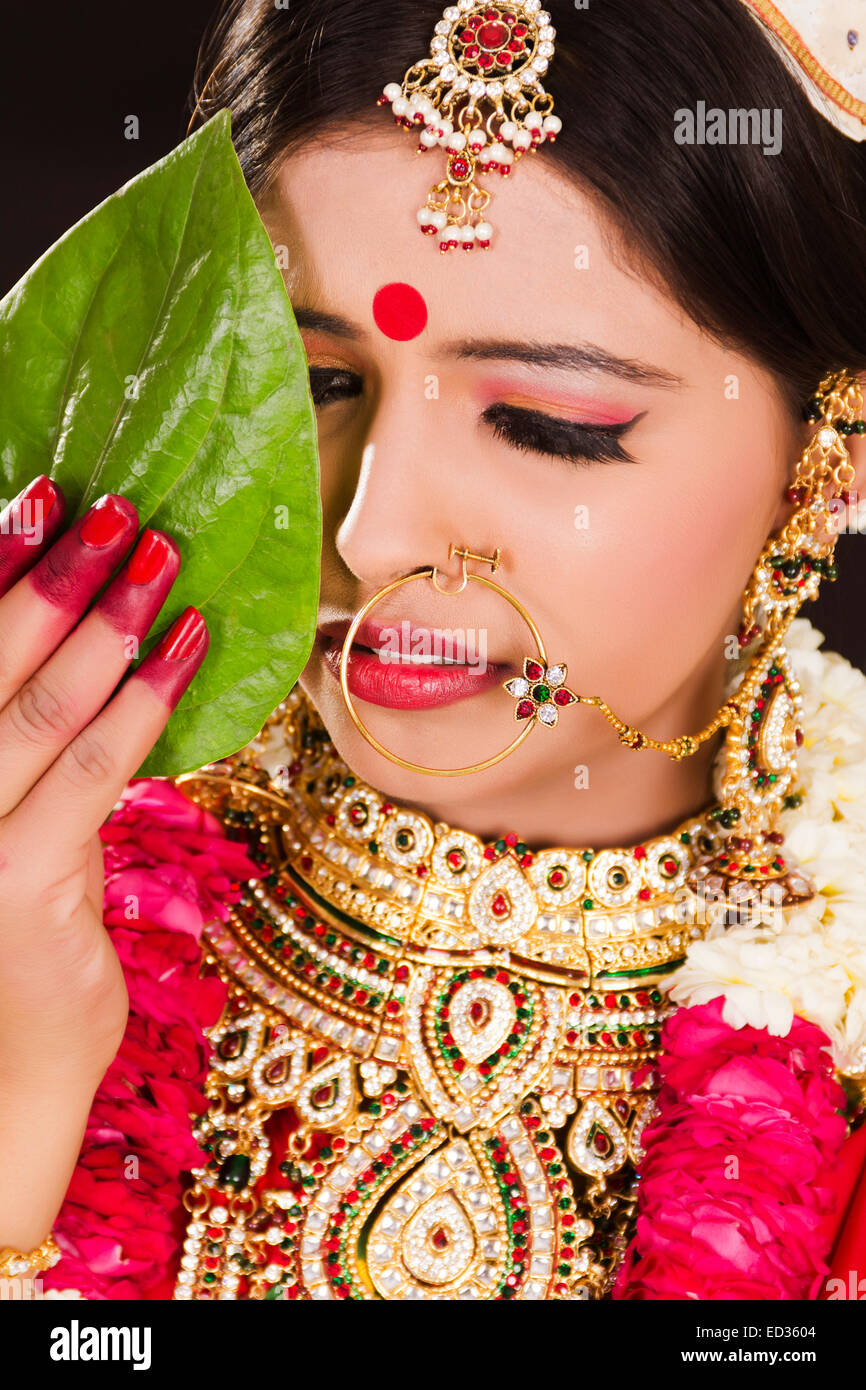 Premium Photo | A bride poses for a photo in a temple.